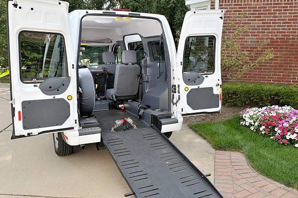 A medical transportation van equipped with a ramp for accessibility.