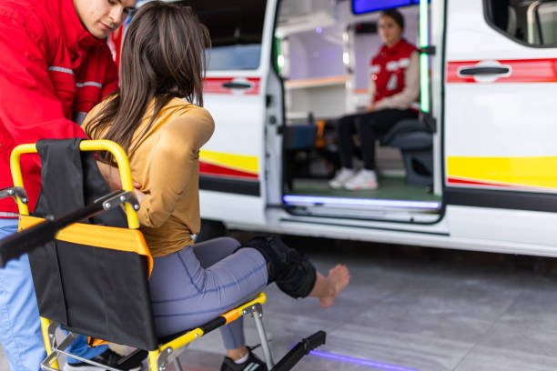 A person in blue gloves maneuvers a stretcher, highlighting the operations of Secure Med Transport in medical transport.