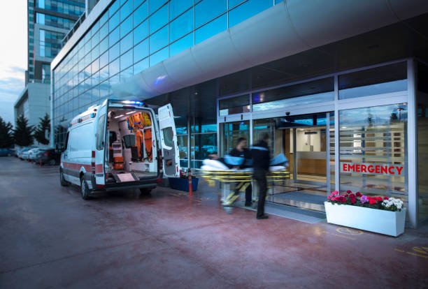Ambulance parked outside a hospital, symbolizing fast medical transportation for urgent patient care.