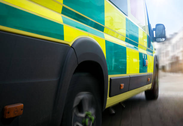  An ambulance driving on the road, symbolizing urgent medical transportation services.