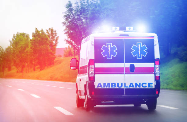 An ambulance in motion on the road, representing essential medical transportation.