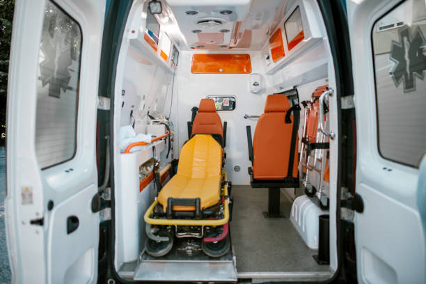  A woman is being assisted into an ambulance from Private Ambulatory Service for emergency medical care.