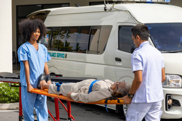 A woman is being placed into an ambulance by paramedics from Private Ambulatory Service for urgent medical attention.