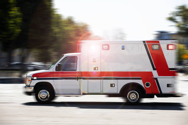  An ambulance stationed outside a hospital, representing quick medical transportation services for emergencies.